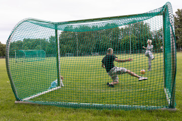 The family is playing at the football stadium