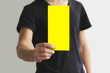 Man showing blank yellow flyer brochure booklet. Leaflet presentation. Pamphlet hold hands. Man show clear offset paper. Sheet template. Booklet design sheet display read first person