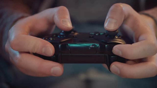 close-up of the game console in the hands of the player 4K resolution