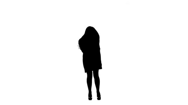 Actress in a retro microphone sings a rock song. White background. Silhouette