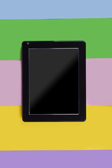 tablet on a pink background