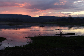 Fishermen at dawn in Manambolo river, Tsingy de Bemaraha National Park. Bekopaka, Mahajanga province, Madagascar