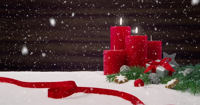 Second Sunday of Advent - Beautiful snowfall in front of a Christmas decoration arrangement on a snowy table in front of a wooden background - ProRes