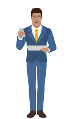 Businessman with mobile phone holding digital tablet PC