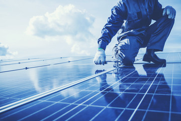 an engineer working on checking and maintenance equipment in solar power plant
