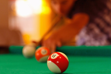 Playing in billiard pool activity.