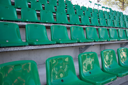 stadium, green chairs in the stands