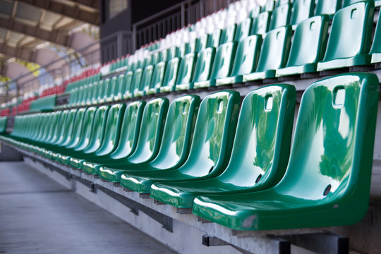 stadium, green chairs in the stands