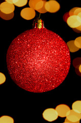 red Christmas ball on black background