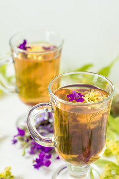 Linden herbal tea in transparent grog glass