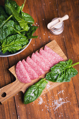 sausage with fresh spinach