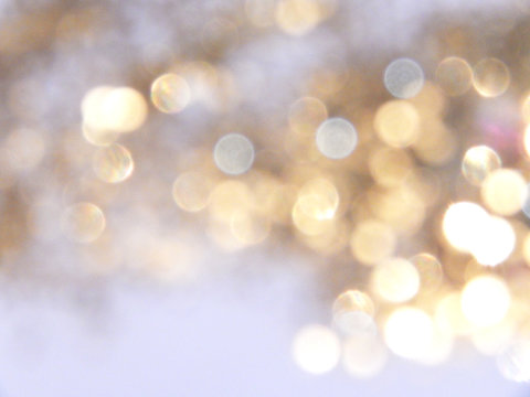 Beautiful blurry golden background, festive bokeh light