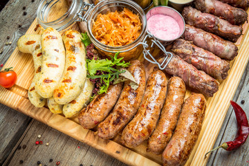 a set of different sausages, grilled on plate