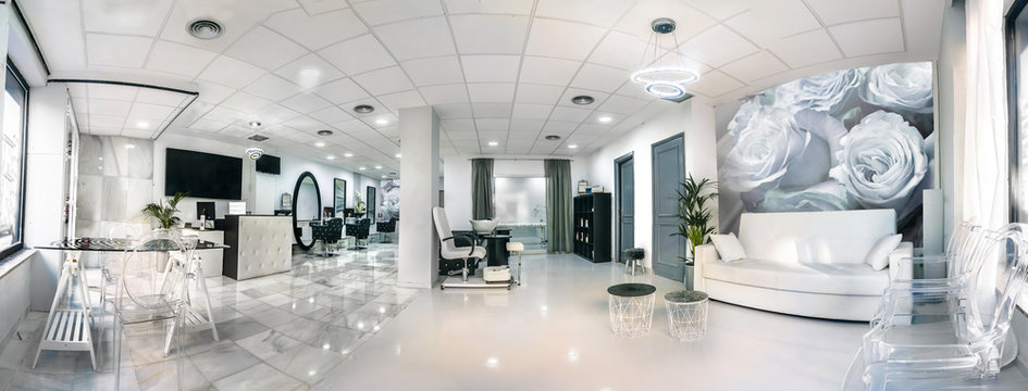 Panoramic view of a modern bright beauty salon. Hair salon interior business