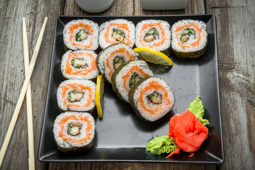 Rainbow Sushi Roll with salmon, eel, tuna, avocado, royal prawn, cream cheese Philadelphia, caviar tobica, chuka. Sushi menu. Japanese food.