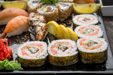 Rainbow Sushi Roll with salmon, eel, tuna, avocado, royal prawn, cream cheese Philadelphia, caviar tobica, chuka. Sushi menu. Japanese food.