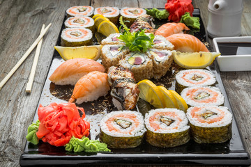 Rainbow Sushi Roll with salmon, eel, tuna, avocado, royal prawn, cream cheese Philadelphia, caviar tobica, chuka. Sushi menu. Japanese food.