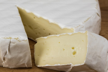 Camembert cheese brie close up sliced.