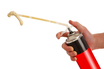 Worker hand holding polyurethane expanding foam glue gun applicator. Balon foam. Isolated on white background. © Dima Plotnikov