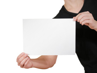 Man in black t shirt holding blank white A4 paper. Leaflet presentation. Pamphlet hold hands. Man...