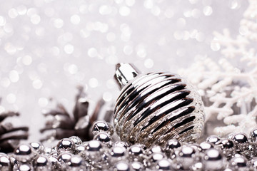 Fototapeta na wymiar Christmas composition of Christmas tree toys on a silver background
