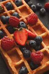 Belgium waffles with berries closeup