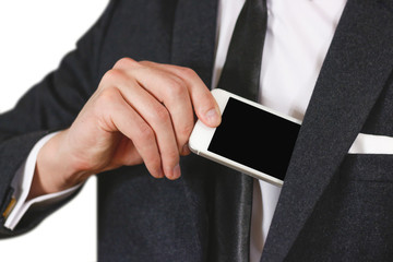 Businessman putting smartphone in suit pocket closeup. Showing blank white phone. Phone hold hands. Show clear telephone. Sheet phone. Man in a black suit, white shirt and tie