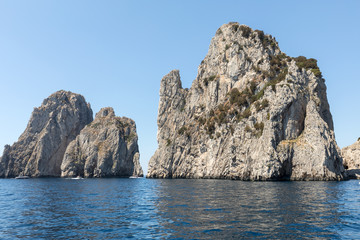 View from the boat on the Faraglioni Rocks on Capri Island, Italy.