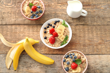 Composition with tasty oatmeal on table