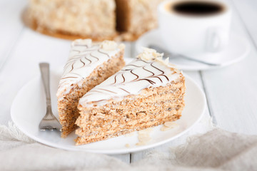 Esterhazy cake sliced on white plate close-up