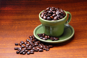 Coffe beans in green cup