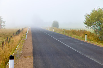 Lonely road countryside with fog