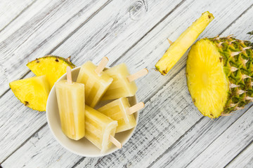 Homemade Pineapple Popsicles (selective focus)
