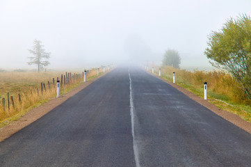 Lonely road with fog