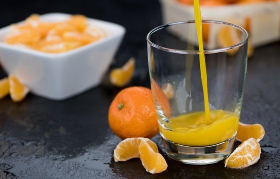 Fresh made Tangerine Juice (close-up shot)