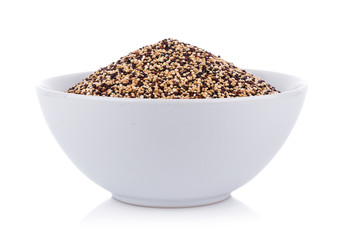 Real quinoa seeds in a bowl isolated on white