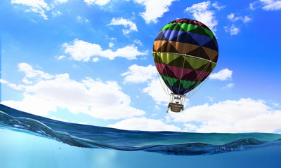 Fototapeta na wymiar Air balloon in sea