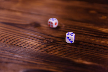 Dice on a wooden table. Gamble concept