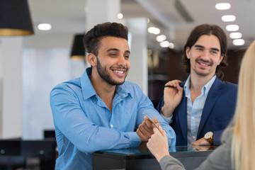 Happy Smiling Business Man Give Credit Card To Female Shop Assistant Paying For Clothes, Successful Businessmen In Luxury Suits Store