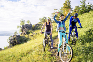 Fototapeta premium People travelling on a bicycle