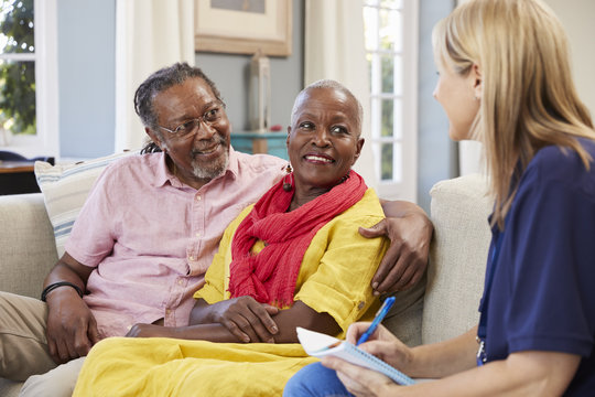 Female Support Worker Visits Senior Couple At Home