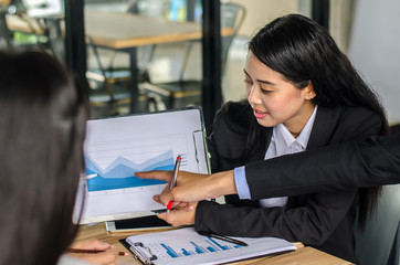 business women conference presentation with team training flipchart office