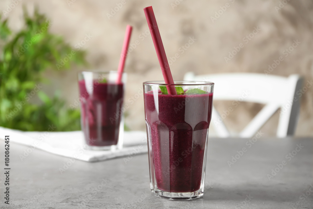 Sticker glass with acai juice on table