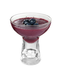 Glass with acai juice and berries on white background