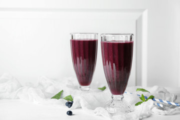 Glasses with acai juice on table