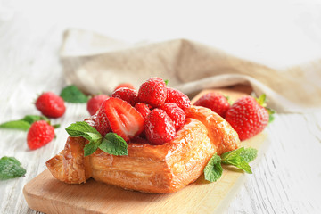 Delicious pastry on wooden board