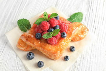 Delicious pastry on wooden table