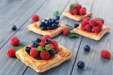 Delicious pastry on wooden table