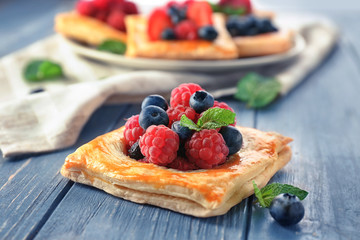 Delicious pastry on wooden table