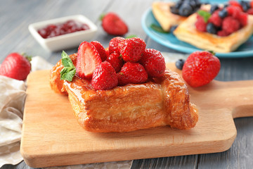 Delicious pastry on wooden board